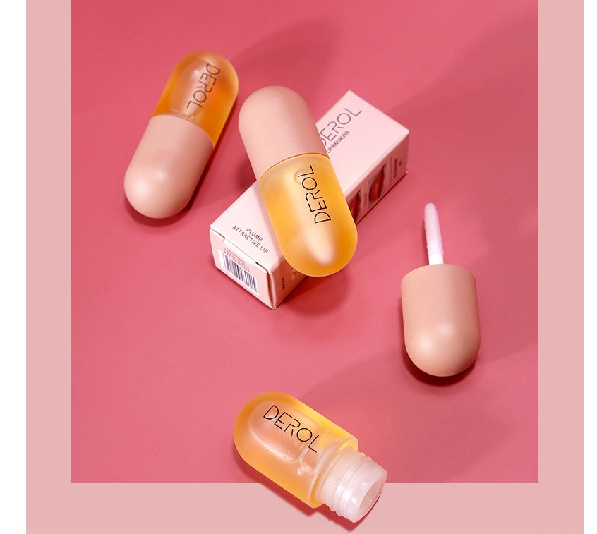 Supersonic Day Night Lip Plumper Oil in clear bottle, nourishing and repairing lip care product with a sleek design.