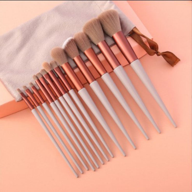Set of 13 Supersonic makeup brushes including concealer, blush, powder, eye shadow, highlighter, and foundation brushes.